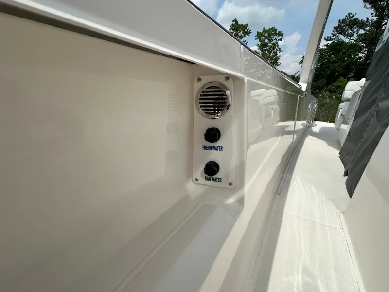 Slide: The Image of 2025 Tiara Yachts 34 LS boat deck with fresh and raw water controls. - 28