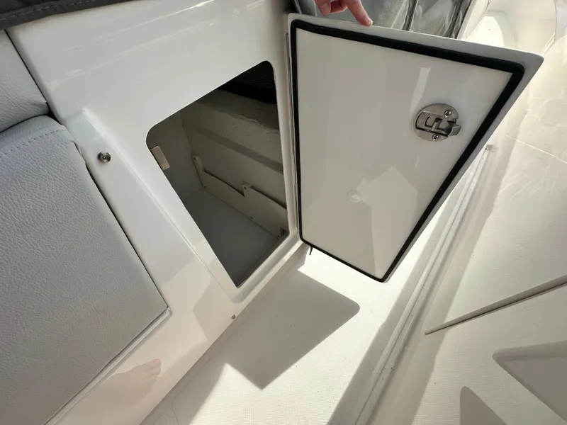 Slide: The Image of Storage compartment on 2025 Tiara Yachts 34 LS, open door revealing interior space. - 38