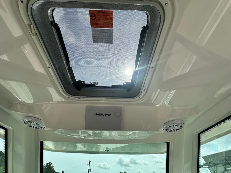 Slide: The Image of Interior view of 2025 Tiara Yachts 34 LS with sunroof and speakers. - 43