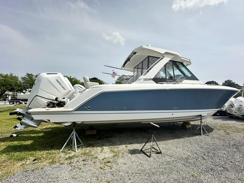 Slide: The Image of 2025 Tiara Yachts 34 LS boat on stands, side view, outdoors. - 6