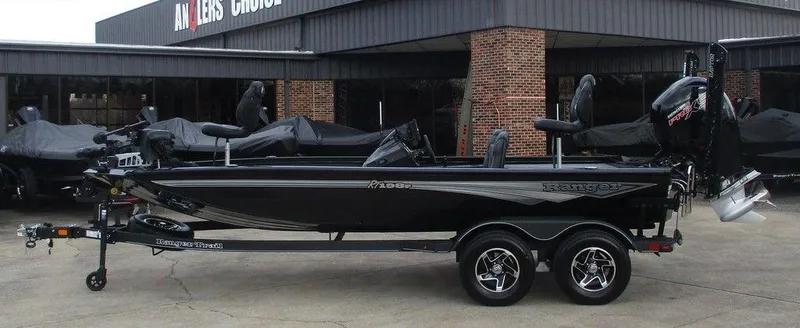 The Image of 2024 Ranger RT198P boat, black, parked on trailer outside dealership. - 1