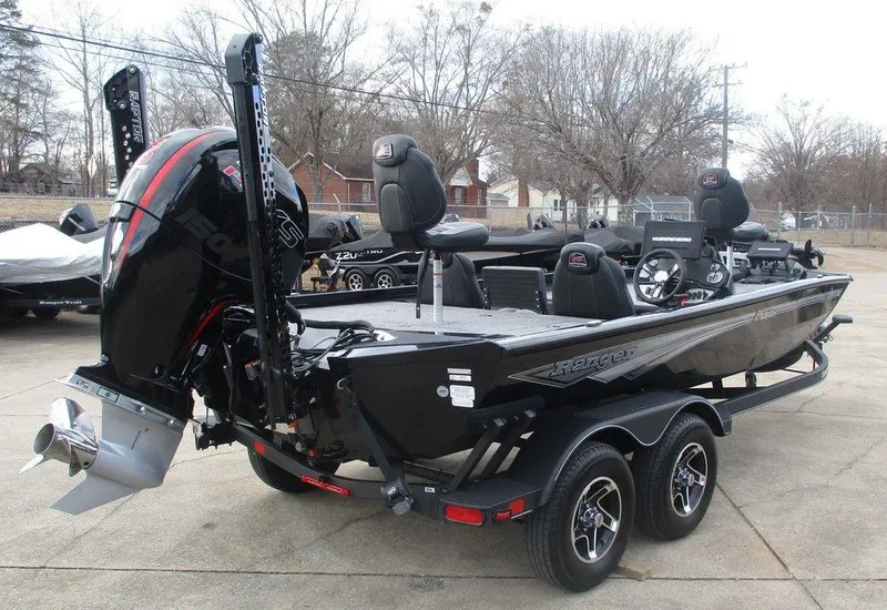 Slide: The Image of 2024 Ranger RT198P boat on trailer, featuring sleek design and powerful outboard motor. - 2