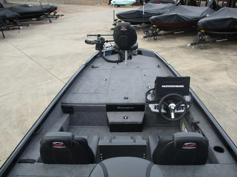 Slide: The Image of 2024 Ranger RT198P fishing boat interior with steering console and seating. - 6