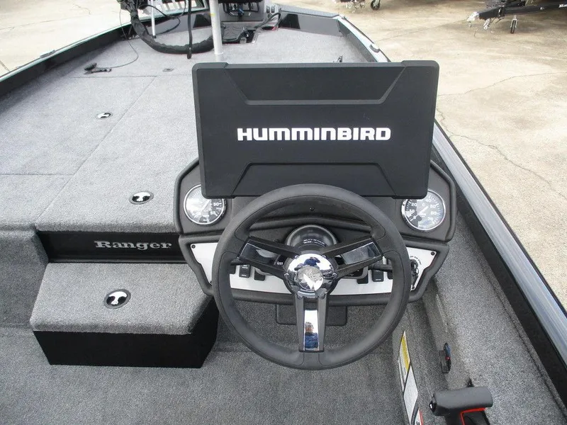 Slide: The Image of 2024 Ranger RT198P boat dashboard with Humminbird display and steering wheel. - 7