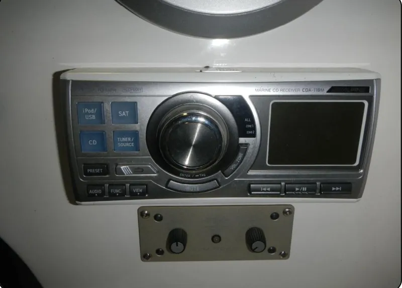 Slide: The Image of Control panel of a 2014 Nordic Powerboats 43 Enforcer, featuring audio and navigation controls. - 11