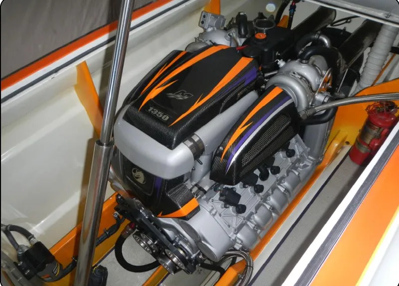 Slide: The Image of 2014 Nordic Powerboats 43 Enforcer engine with vibrant orange and black detailing. - 15