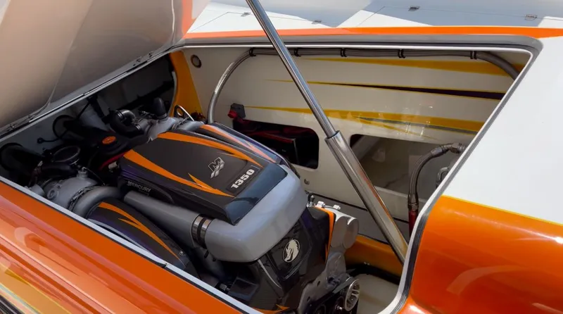 Slide: The Image of 2014 Nordic Powerboats 43 Enforcer engine compartment with vibrant orange detailing. - 16