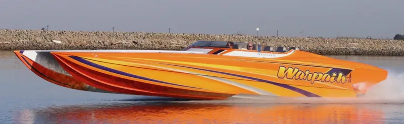Slide: The Image of 2014 Nordic Powerboats 43 Enforcer speeding on water, vibrant orange design. - 21