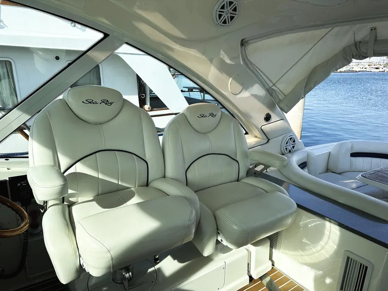 Slide: The Image of 2006 Sea Ray 48 Sundancer interior with luxurious white leather seating. - 10