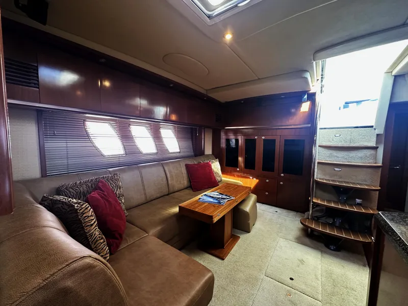 Slide: The Image of Luxurious interior of 2006 Sea Ray 48 Sundancer yacht with plush seating and elegant wood finishes. - 17