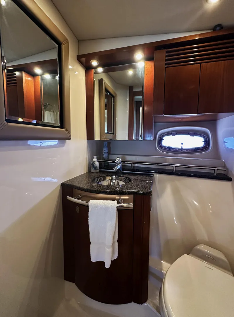 Slide: The Image of Luxurious bathroom interior of 2006 Sea Ray 48 Sundancer yacht with elegant wood cabinetry. - 22