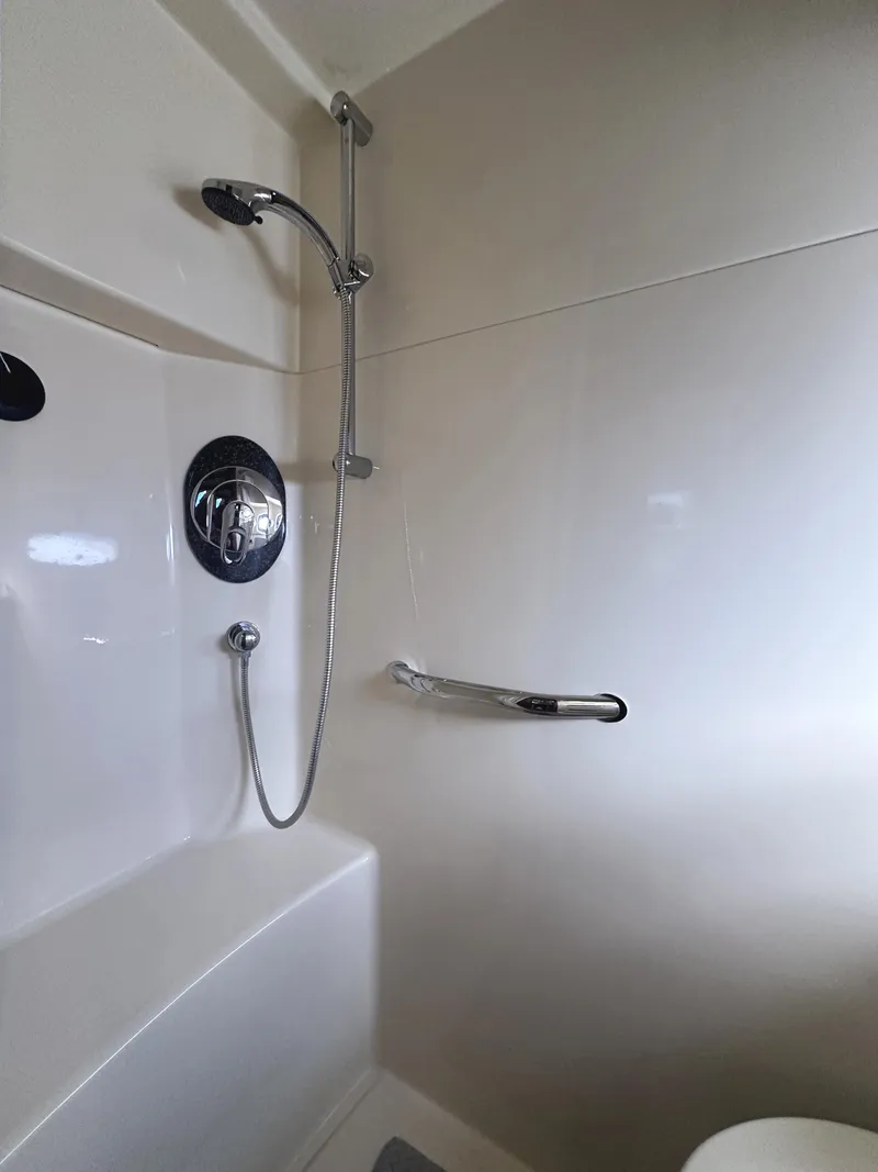 Slide: The Image of Shower area in 2006 Sea Ray 48 Sundancer yacht, featuring modern fixtures and sleek design. - 27