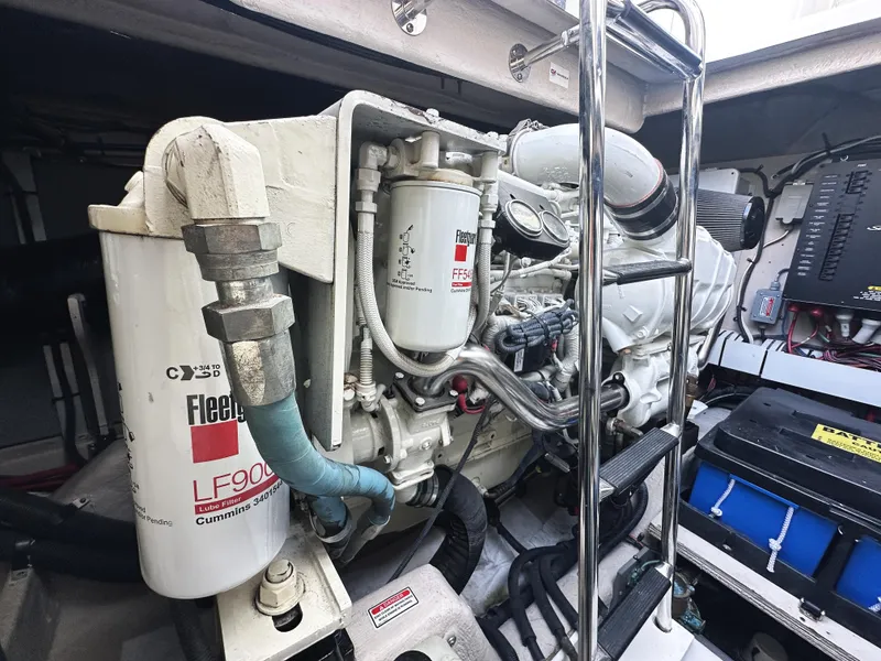 Slide: The Image of Engine compartment of 2006 Sea Ray 48 Sundancer, featuring Cummins marine engine components. - 30
