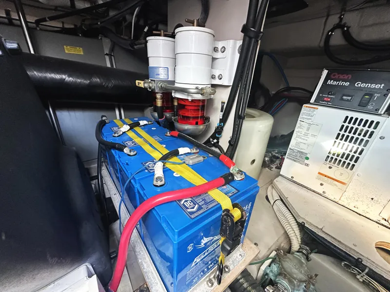 Slide: The Image of Engine room of 2006 Sea Ray 48 Sundancer with battery and marine generator. - 32