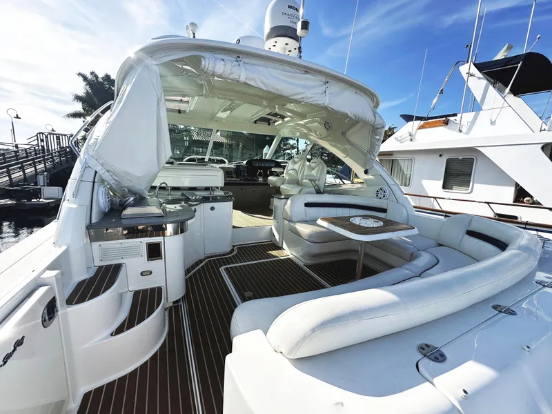 Slide: The Image of 2006 Sea Ray 48 Sundancer yacht with spacious deck and luxurious seating. - 5