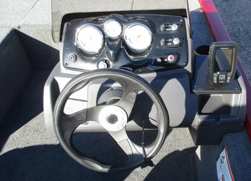 Slide: The Image of 2025 Tracker Pro 170 boat dashboard with steering wheel and gauges. - 6