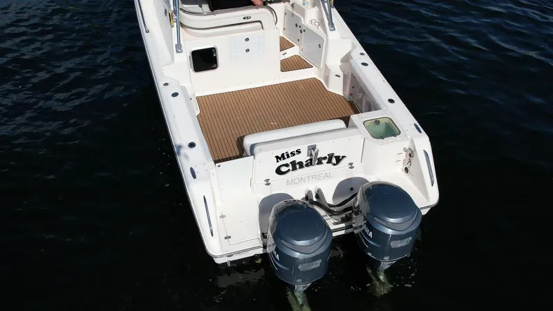 Slide: The Image of 2008 Pursuit 315 Offshore boat with dual engines on water. - 10