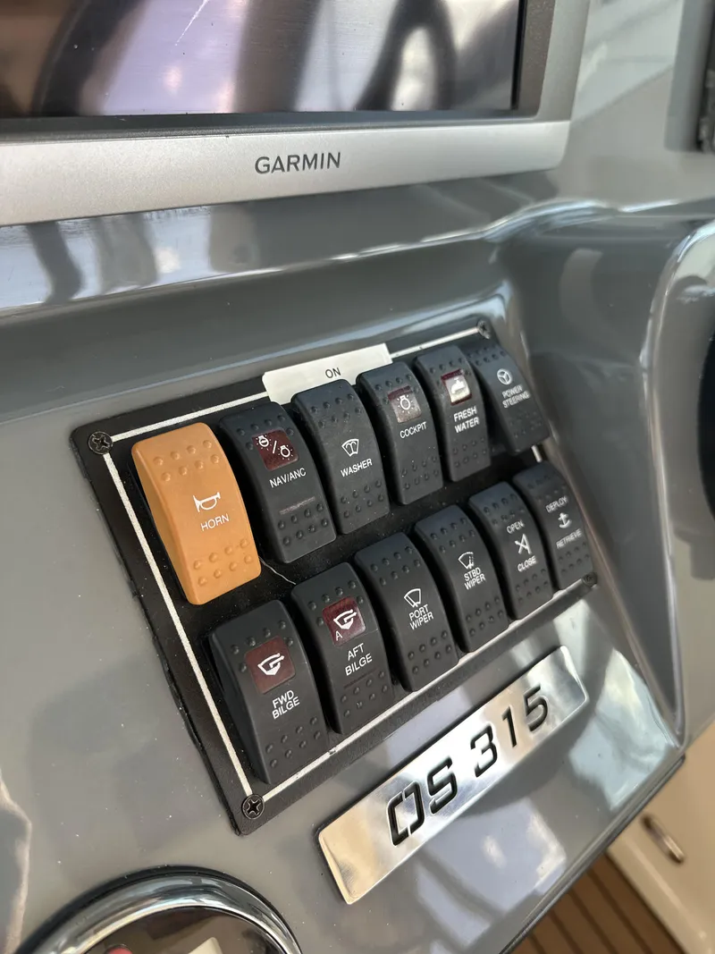 Slide: The Image of Control panel of a 2008 Pursuit 315 Offshore boat with Garmin display. - 20