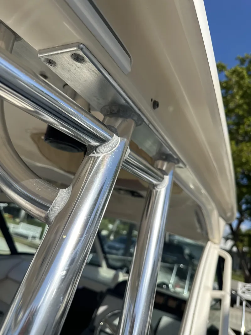 Slide: The Image of Close-up of a 2008 Pursuit 315 Offshore boat's stainless steel rod holders. - 24