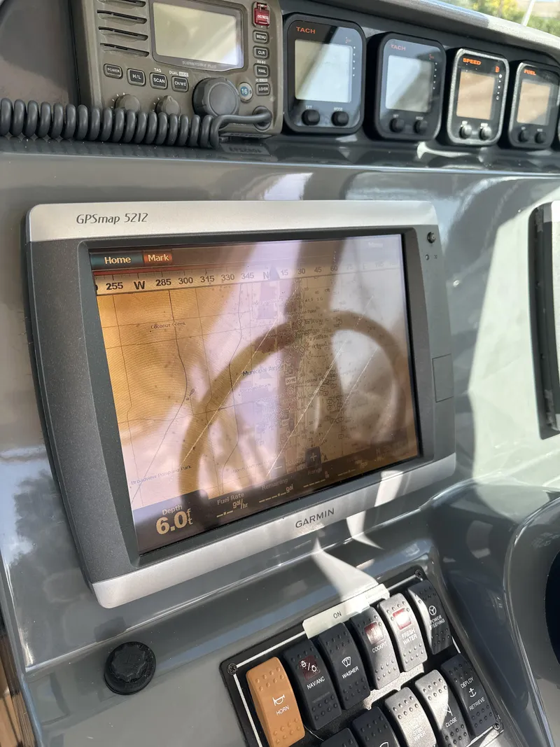 Slide: The Image of Control panel of a 2008 Pursuit 315 Offshore boat with Garmin GPS display. - 39