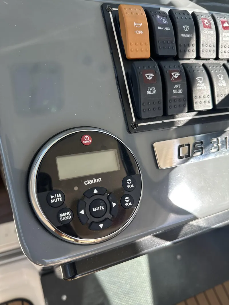 Slide: The Image of Control panel of a 2008 Pursuit 315 Offshore boat with Clarion audio system. - 40