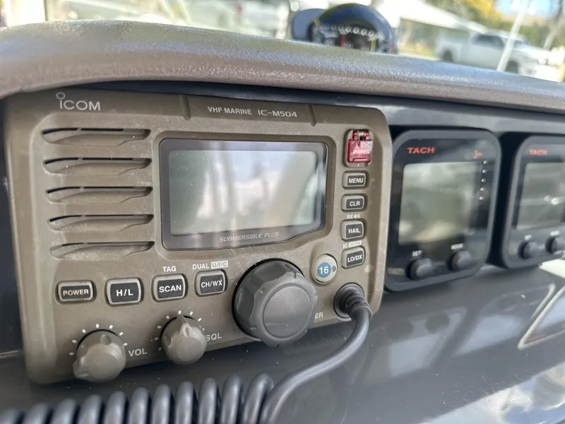 Slide: The Image of VHF marine radio on 2008 Pursuit 315 Offshore boat dashboard, featuring Icom IC-M504 model. - 41