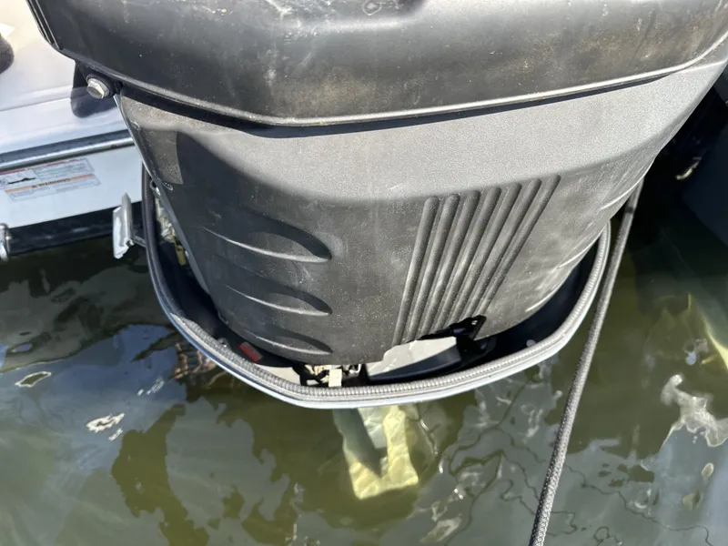 Slide: The Image of Outboard motor of a 2008 Pursuit 315 Offshore boat in water. - 44