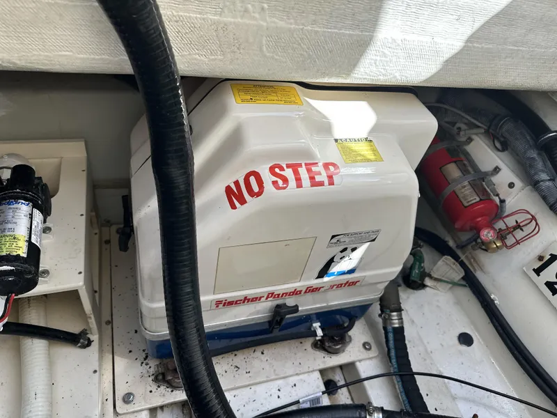 Slide: The Image of Fischer Panda generator in 2008 Pursuit 315 Offshore boat engine compartment. - 48