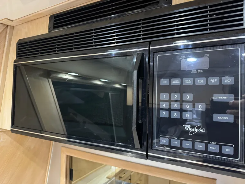 Slide: The Image of Whirlpool microwave in a 1995 Bayliner 4788 yacht kitchen. - 28