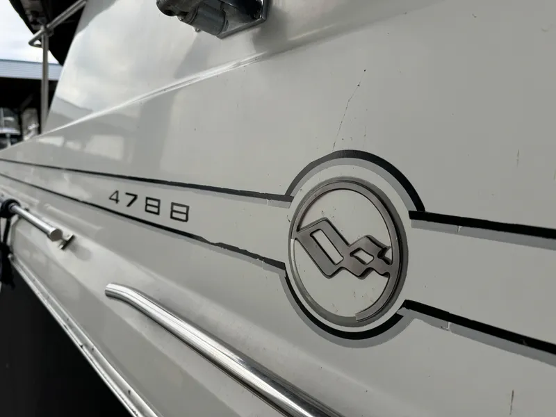 Slide: The Image of Close-up of 1995 Bayliner 4788 yacht exterior with logo and model number. - 3