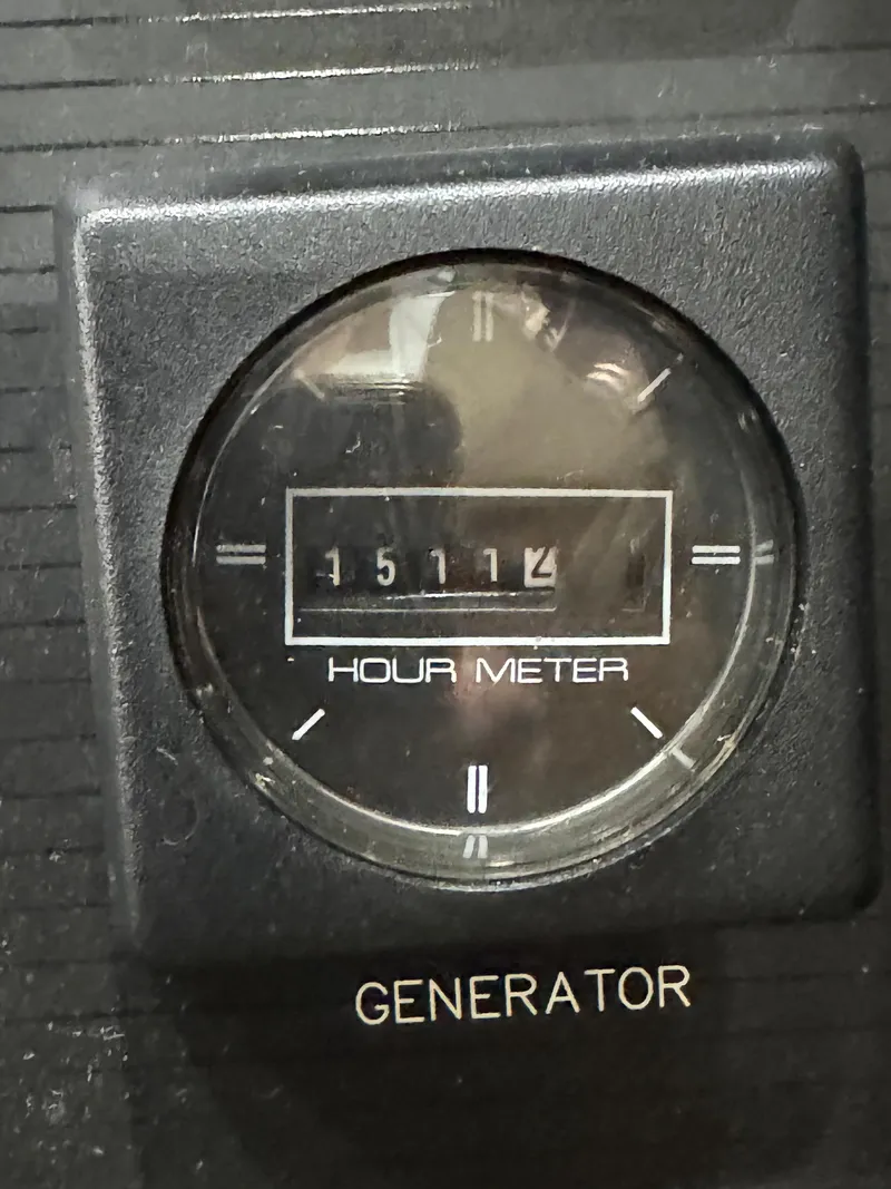 Slide: The Image of Hour meter reading 1511.2 on 1995 Bayliner 4788 generator panel. - 41