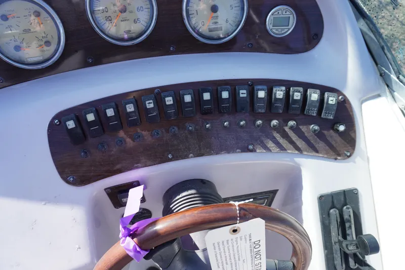 Slide: The Image of Dashboard of 2006 Chaparral 280SSi boat with gauges and switches. - 11