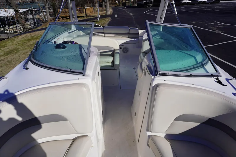 Slide: The Image of 2006 Chaparral 280SSi boat interior with dual windshields and seating. - 15