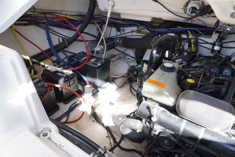 Slide: The Image of Engine compartment of a 2006 Chaparral 280SSi boat with visible wiring and components. - 6