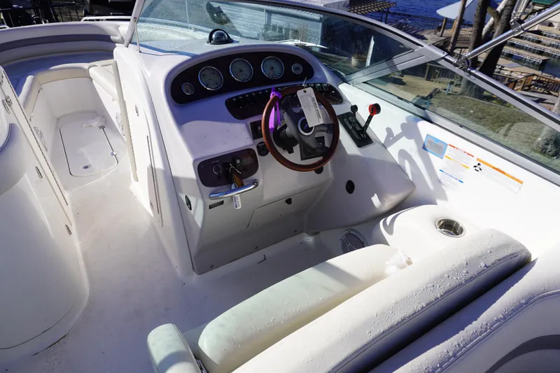 Slide: The Image of 2006 Chaparral 280SSi boat cockpit with steering wheel and control panel. - 9