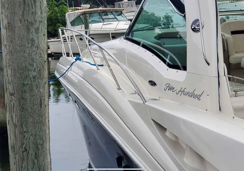 Slide: The Image of 2004 Sea Ray 500 Sundancer yacht docked at marina, side view. - 6