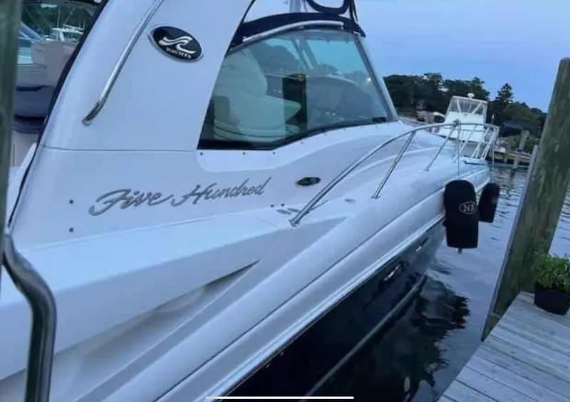 Slide: The Image of 2004 Sea Ray 500 Sundancer yacht docked at marina, side view. - 8