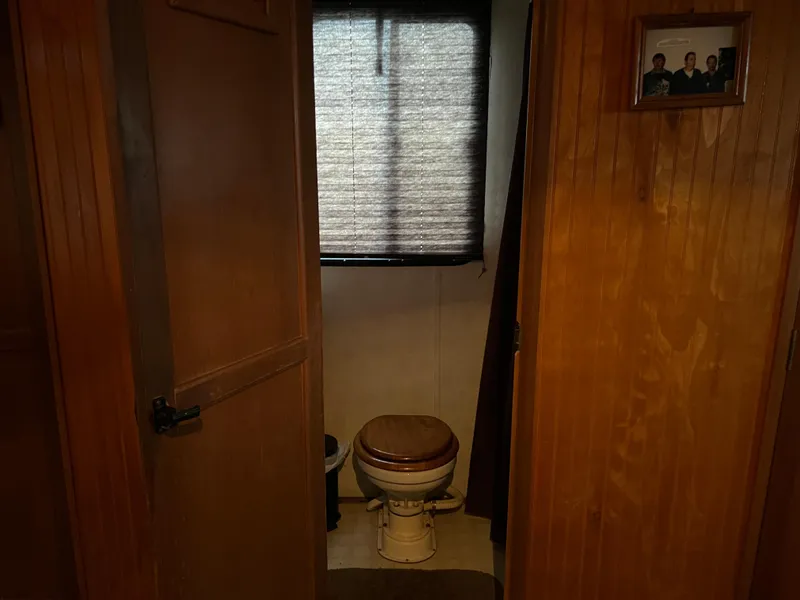 Slide: The Image of 1996 Gibson 41 Sunsport bathroom with wooden door and window blinds. - 16