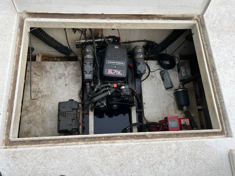 Slide: The Image of Engine compartment of 1996 Gibson 41 Sunsport boat, featuring a MerCruiser 5.7L engine. - 5