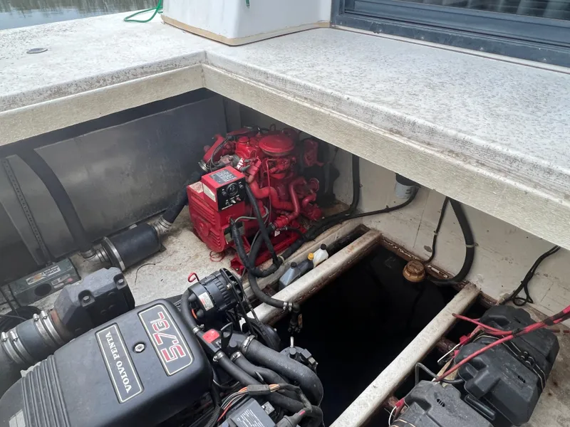 Slide: The Image of Engine compartment of a 1996 Gibson 41 Sunsport boat, featuring visible mechanical components. - 6