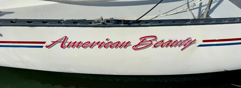 Slide: The Image of Sailboat "American Beauty" with red, white, and blue stripes, Schock NY 36, 1984 model. - 1