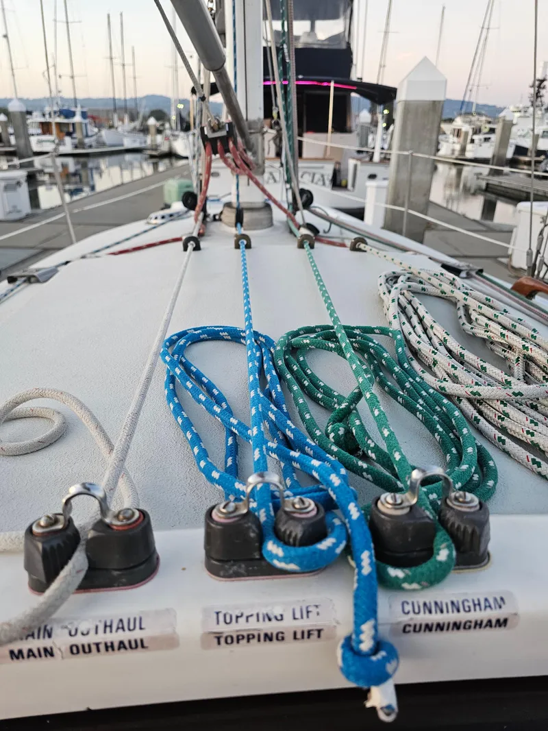 Slide: The Image of Sailboat deck with colorful ropes, Schock NY 36, 1984, docked at marina. - 12