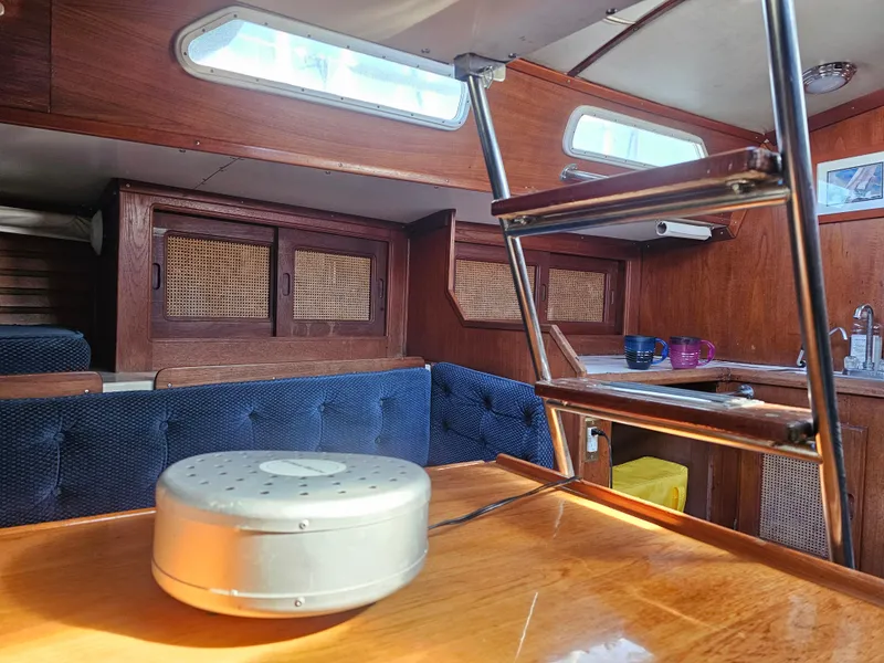 Slide: The Image of Interior of 1984 Schock NY 36 sailboat with wooden cabinetry and seating. - 41