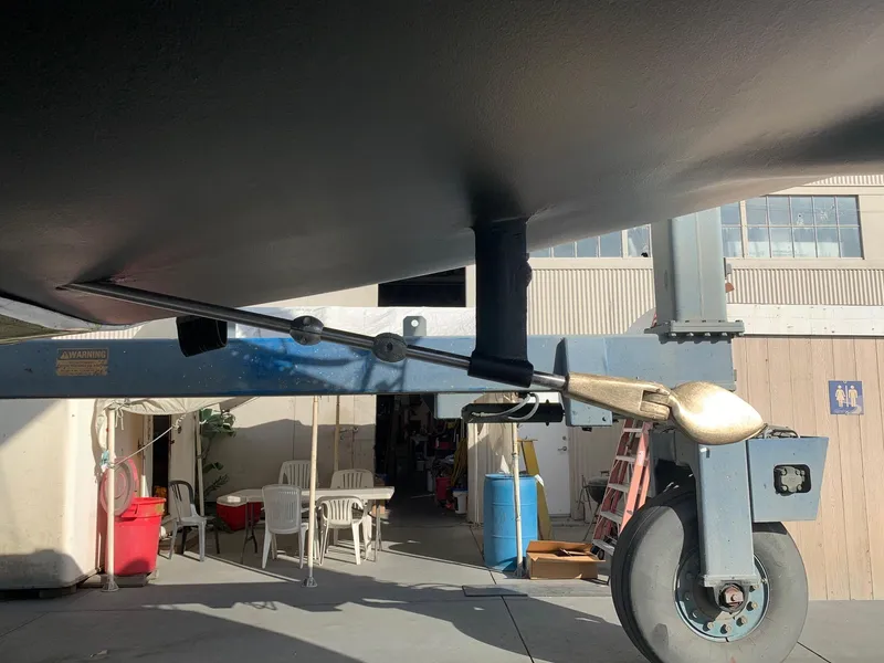 Slide: The Image of Close-up of Schock NY 36 sailboat's rudder and propeller, 1984 model, in a boatyard. - 49