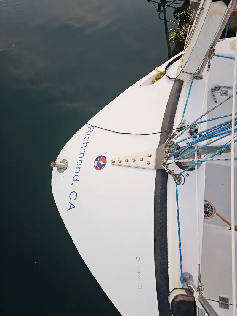 Slide: The Image of Sailboat stern with "Richmond, CA" text, Schock NY 36, 1984 model, docked in calm water. - 7