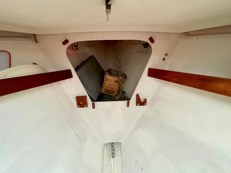Slide: The Image of Interior view of a 1980 Hinterhoeller Niagra sailboat showing anchor storage area. - 20
