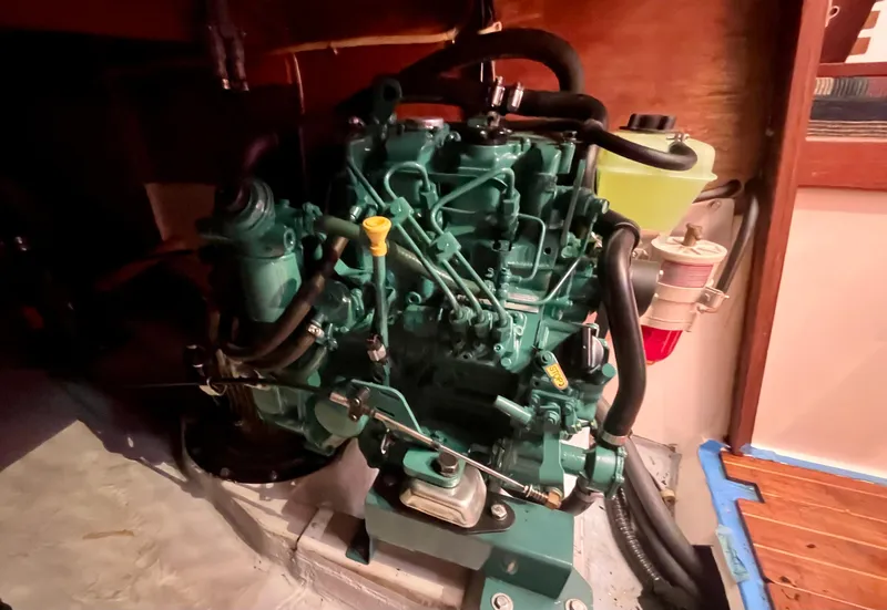Slide: The Image of 1980 Hinterhoeller Niagra engine, green, detailed view in a wooden compartment. - 21