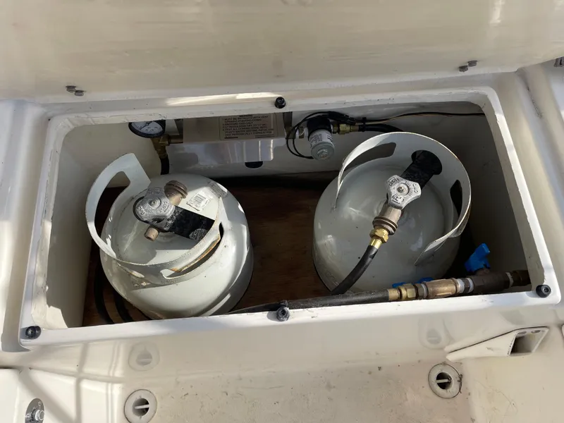 Slide: The Image of Two propane tanks in a 1980 Hinterhoeller Niagra storage compartment. - 27