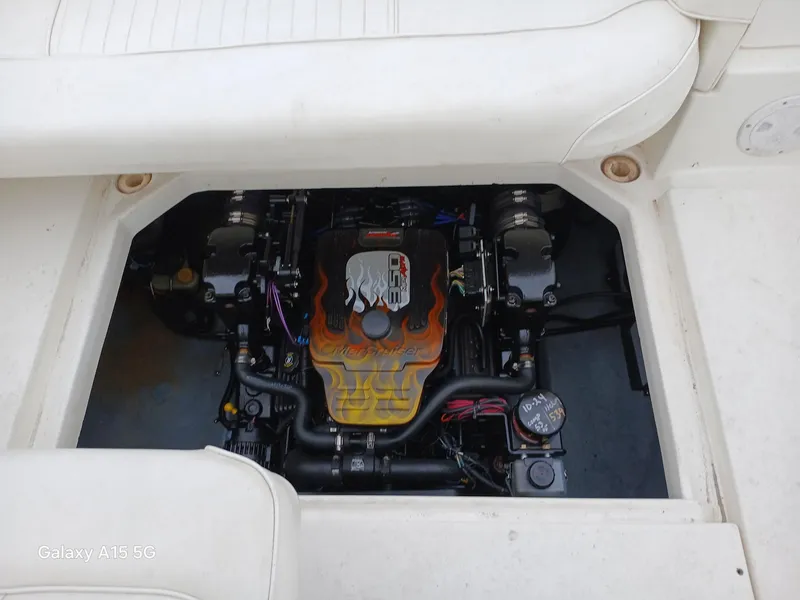 Slide: The Image of Engine compartment of a 1997 Sea Ray 240 Sundancer with custom flame design. - 13