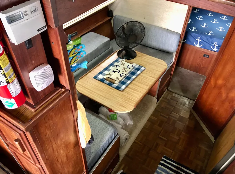 Slide: The Image of Interior of 1985 Marinette 32 Sedan Flybridge with cozy seating and nautical decor. - 24
